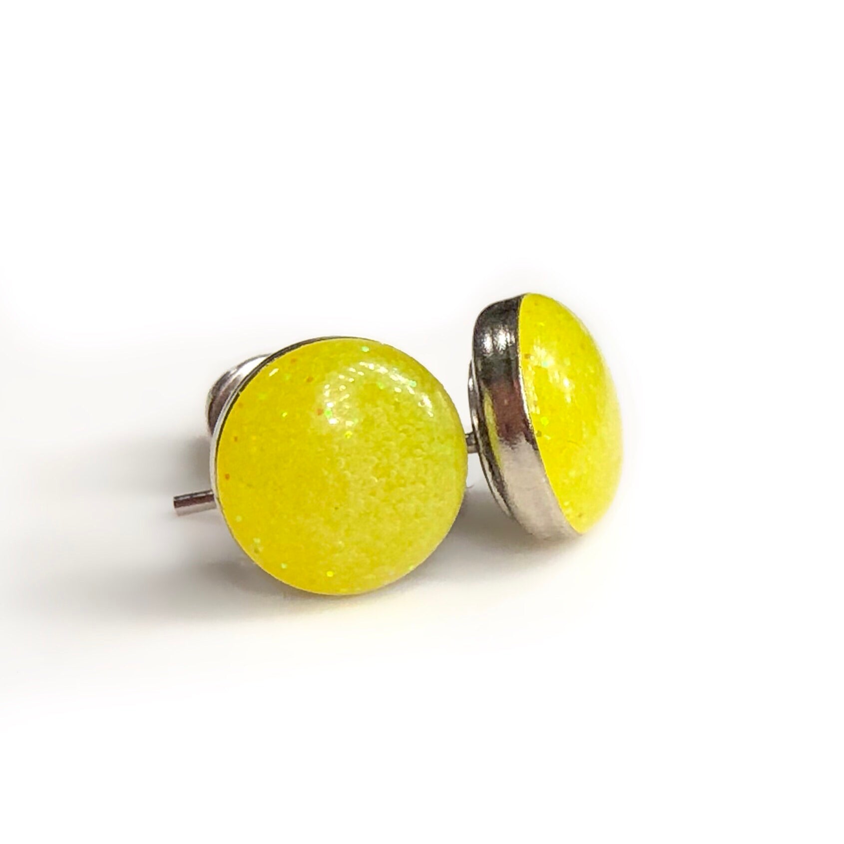 Neon yellow resin cast earrings on a silver stud.